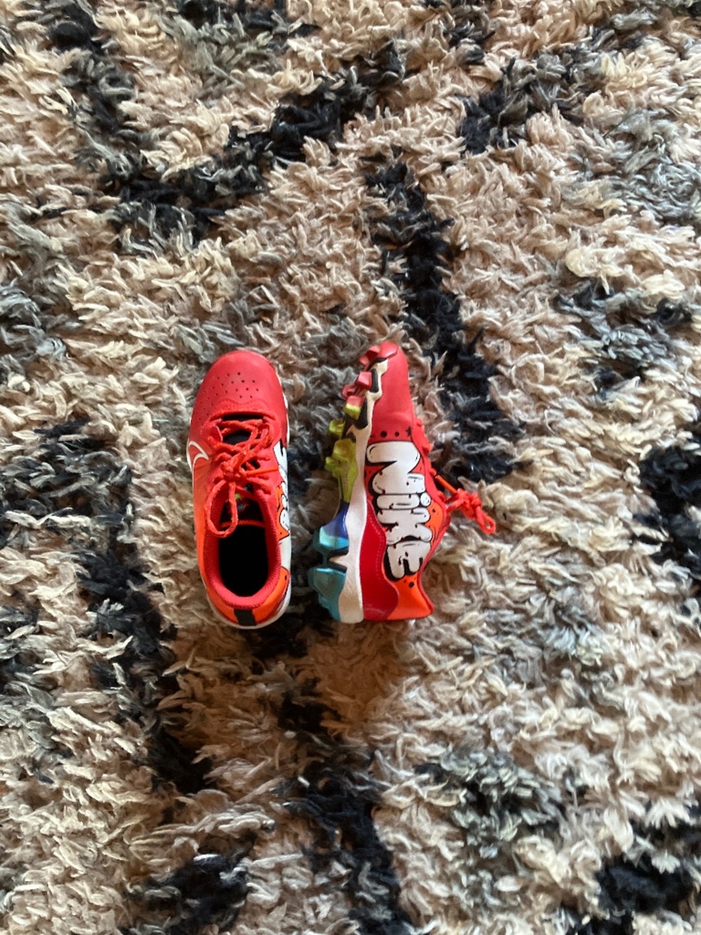 Graffiti Nike cleats fast flex